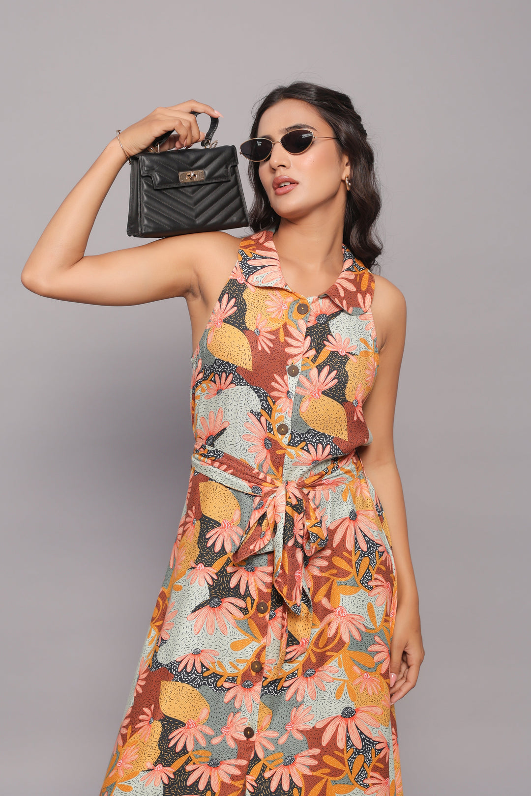 Woman wearing strapless beige floral maxi dress with side slit, Western wear fashion