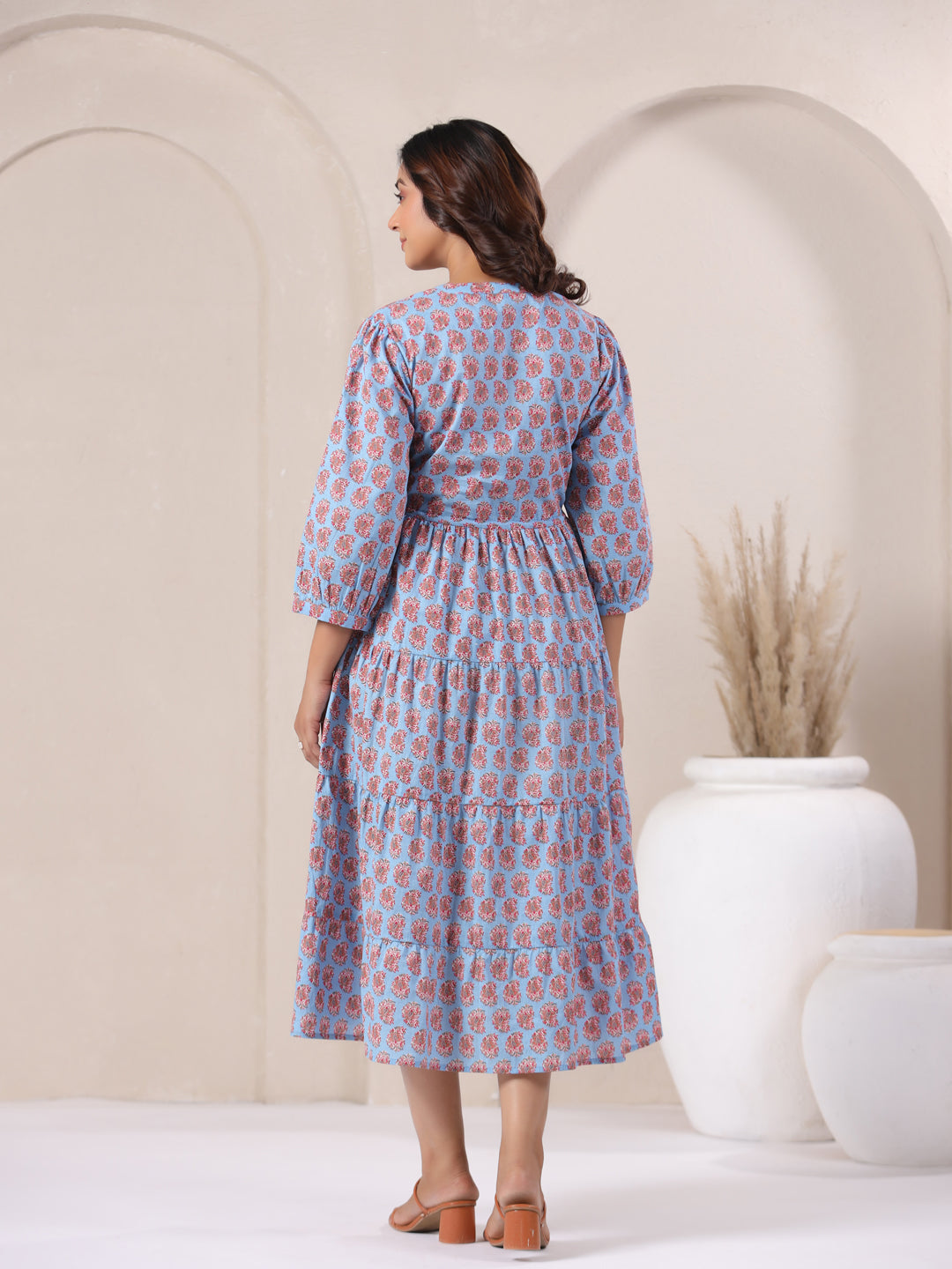 Back view of paisley dress featuring flowing cotton maxi length
