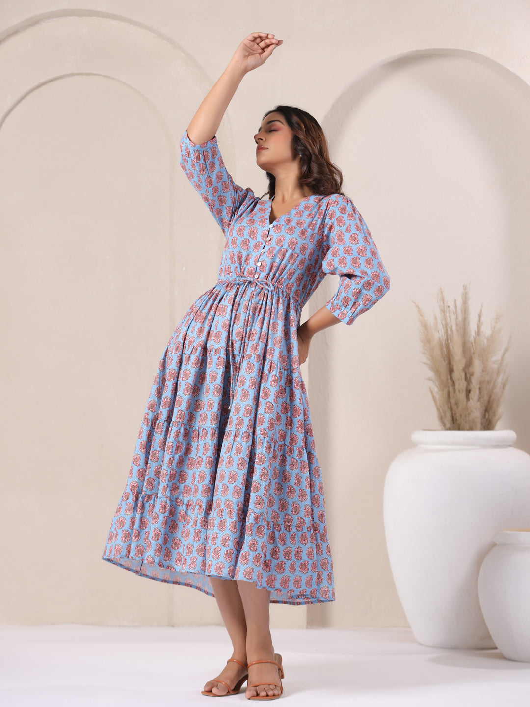 Model wearing powder blue paisley print dress for summer party look