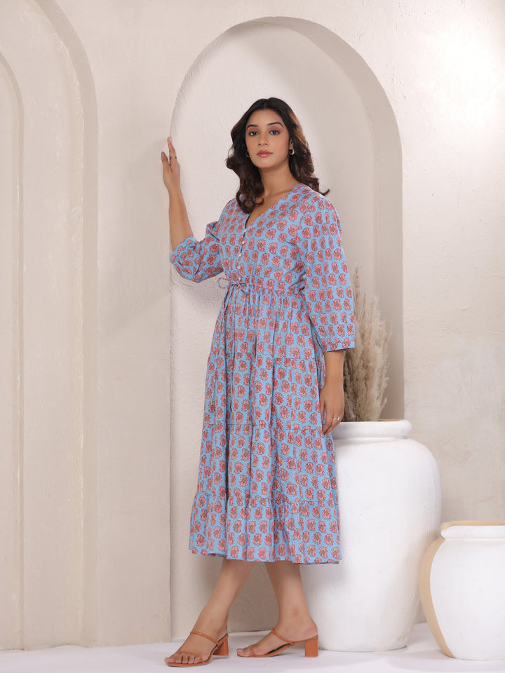 Left side angle of paisley print dress showing fit and flare silhouette