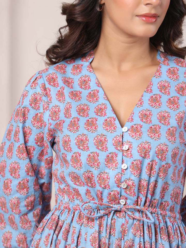 Hemline detail of powder blue paisley print maxi dress with flowing finish