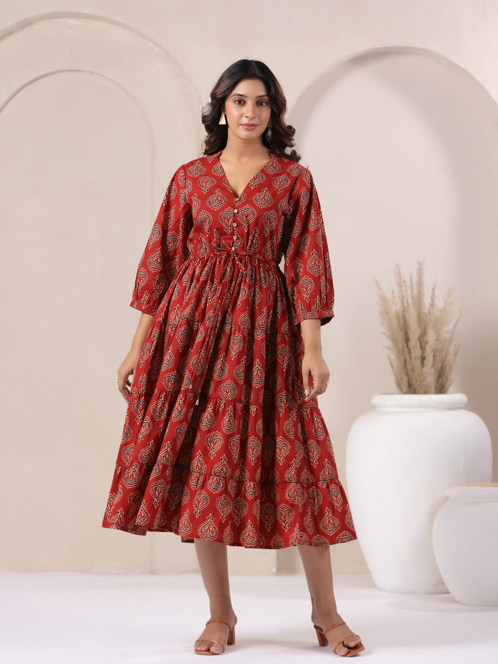 Model wear a Red Ajrakh Buta Print Cotton Maxi Dress with V-Neck and Flared Fit 