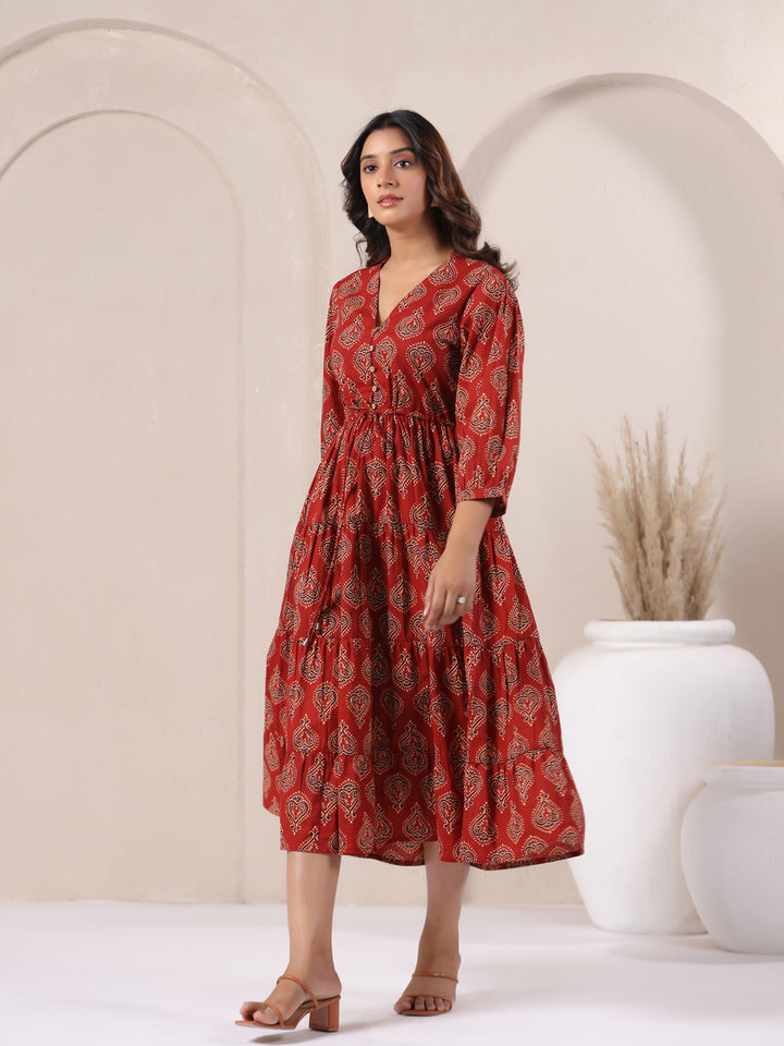Side angle view of red Ajrakh buta print cotton flared maxi dress