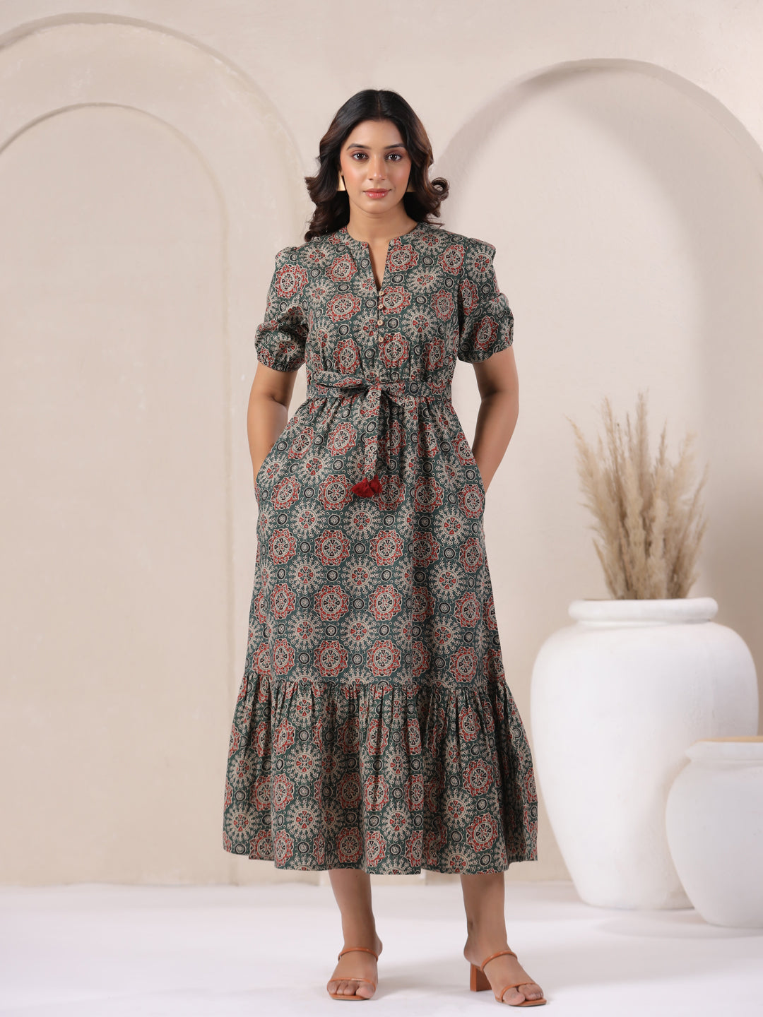 model Front view of green Ajrakh print cotton long bohemian dress for women
