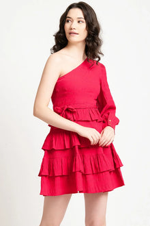 Woman wearing a one-shoulder red tiered mini dress with ruffle details and long sleeve