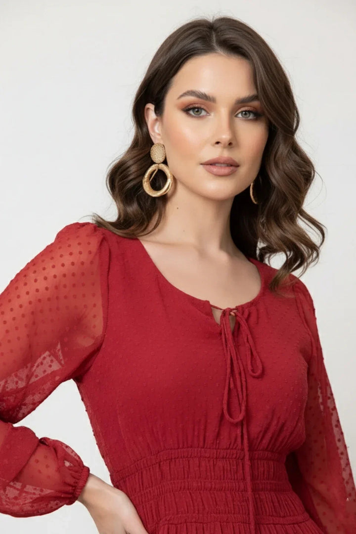 Close-up of the textured Dobby fabric and V-neckline detail on the red dress | June 9 Clothing