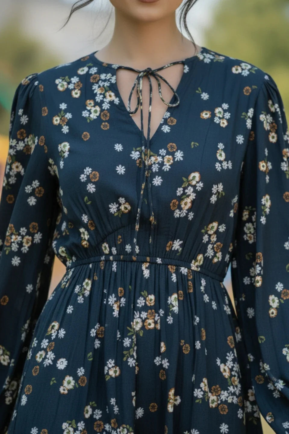 Close-up of the delicate floral pattern on the Prussian blue crepe fabric playsuit | June 9 Clothing