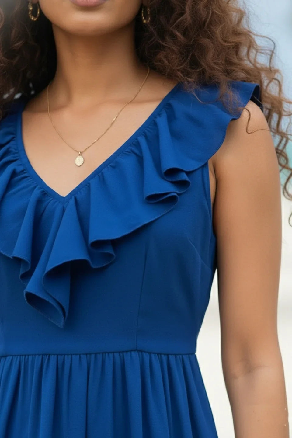 Close-up view of fabric texture of blue mini dress for women