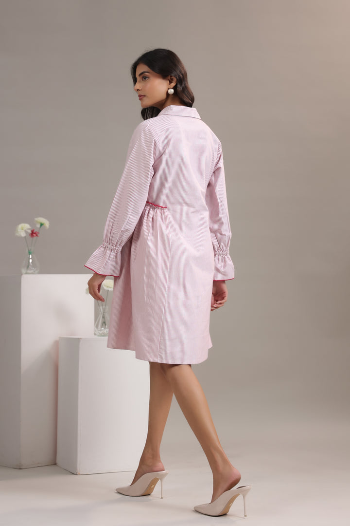 Back view(2) of a red and white striped midi dress showing comfortable fit.