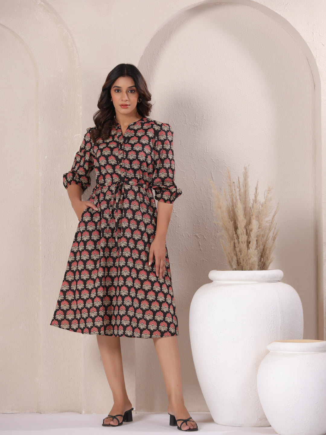Black Ajrakh Buta print cotton midi dress with V-neck and 3/4 sleeves.
