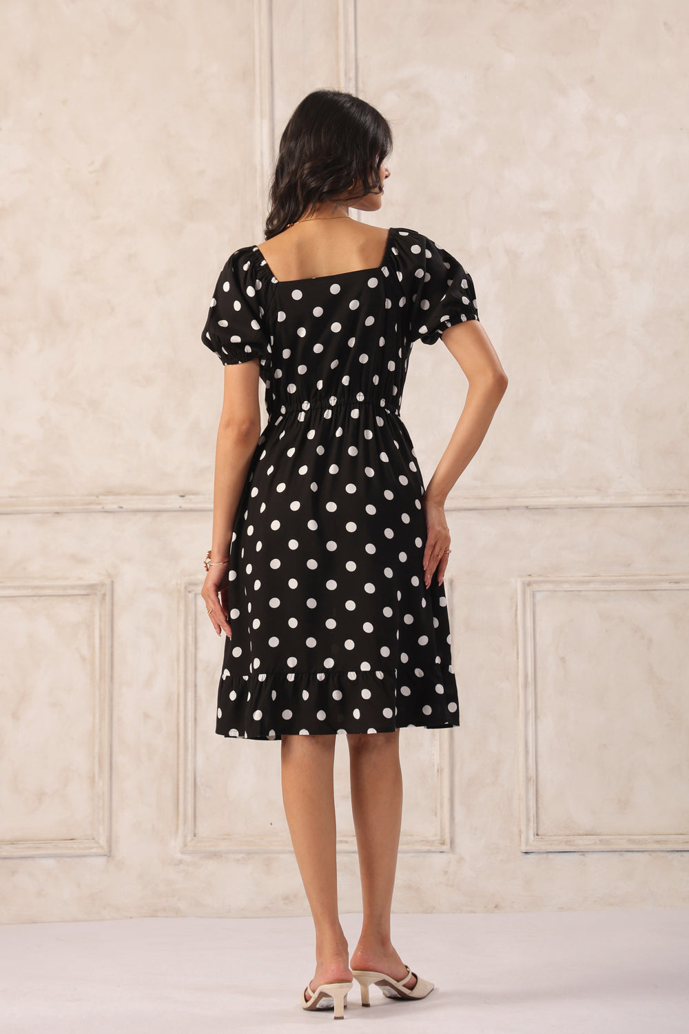 Black polka dot mini dress back view women short flared casual summer dress