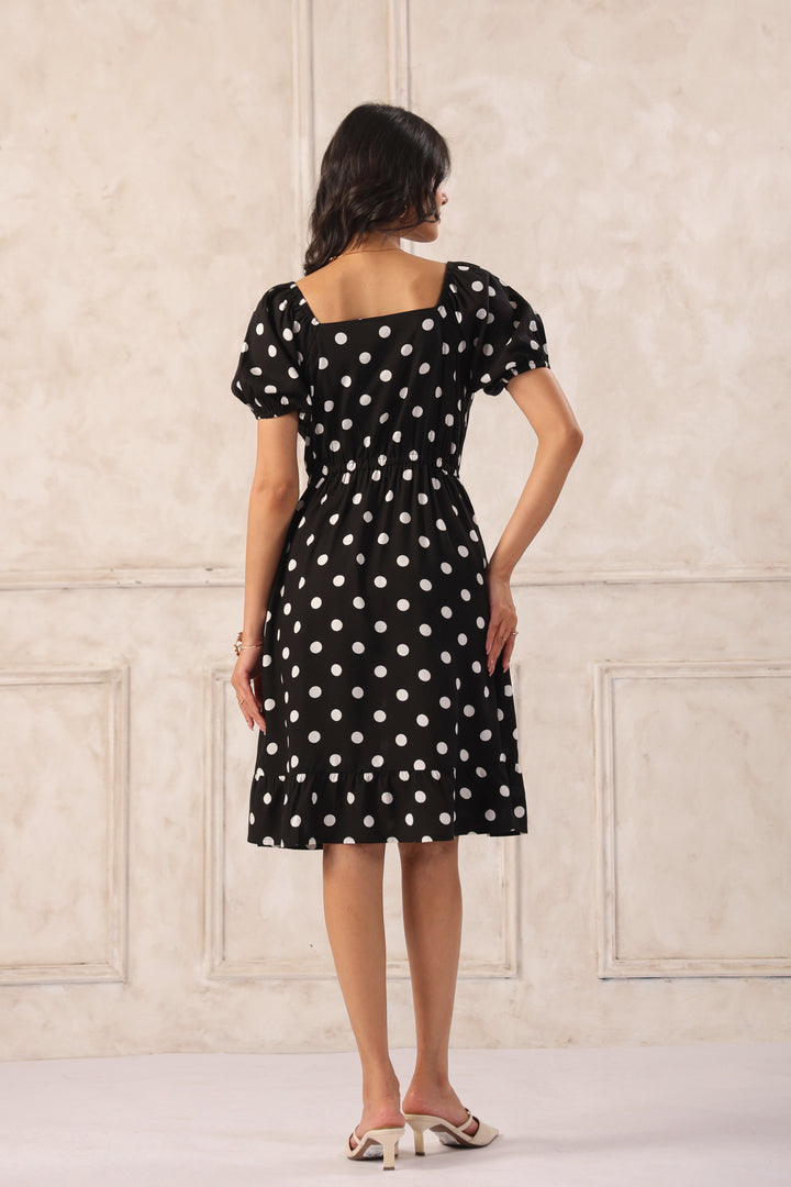 Black polka dot mini dress back view women short flared casual summer dress