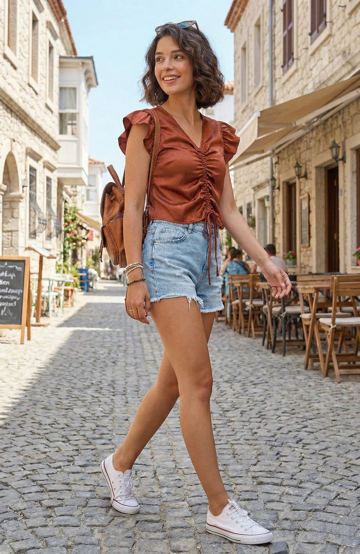 Side view of satin ruched polka dot crop top for women