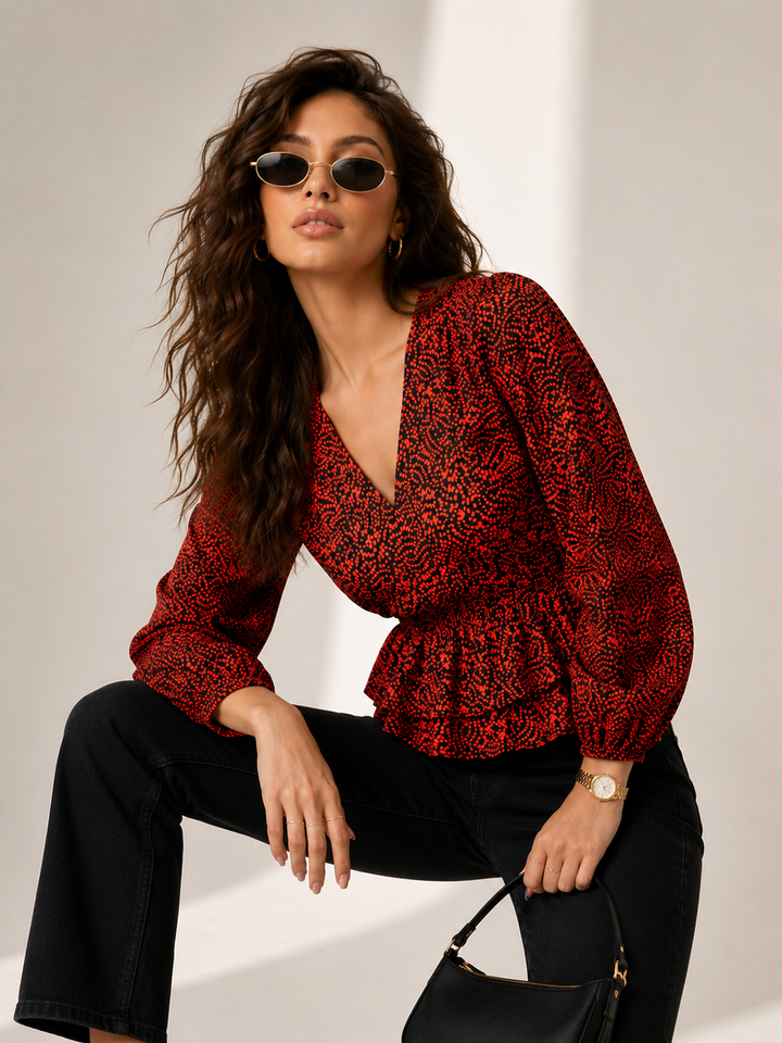 Red patterned wrap top with puff sleeves, styled with black jeans and sunglasses for Western wear