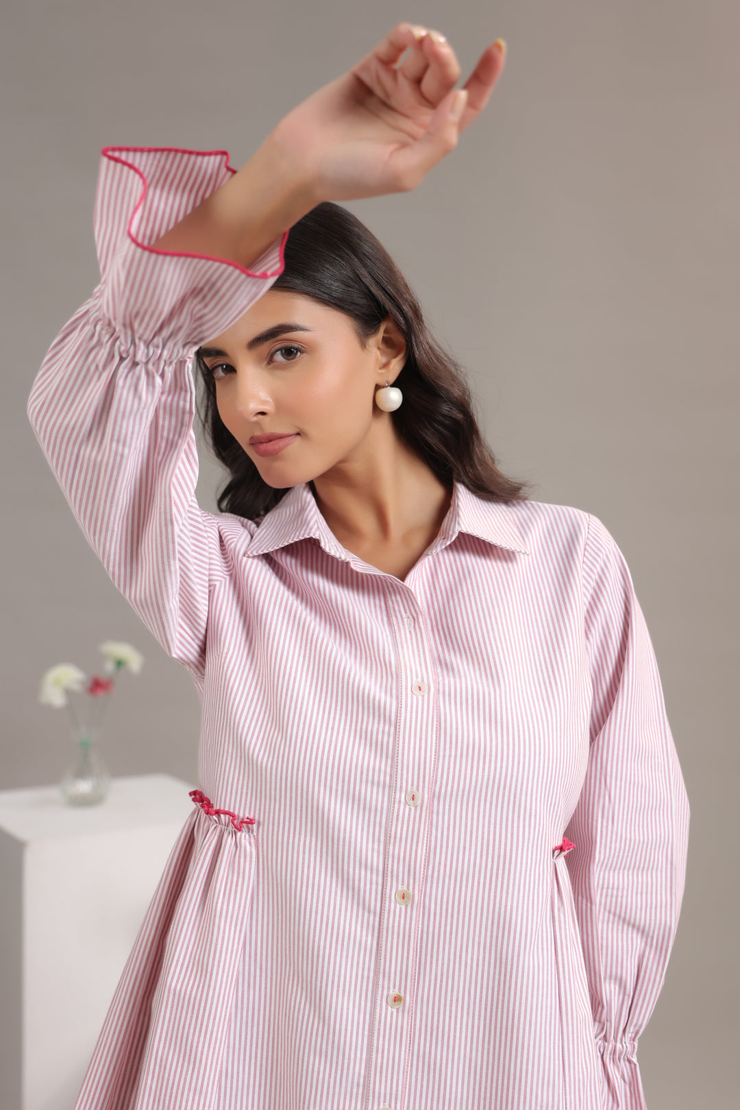 Close-up of the high-quality cotton fabric and vertical pattern of our Red And White Striped Dress.