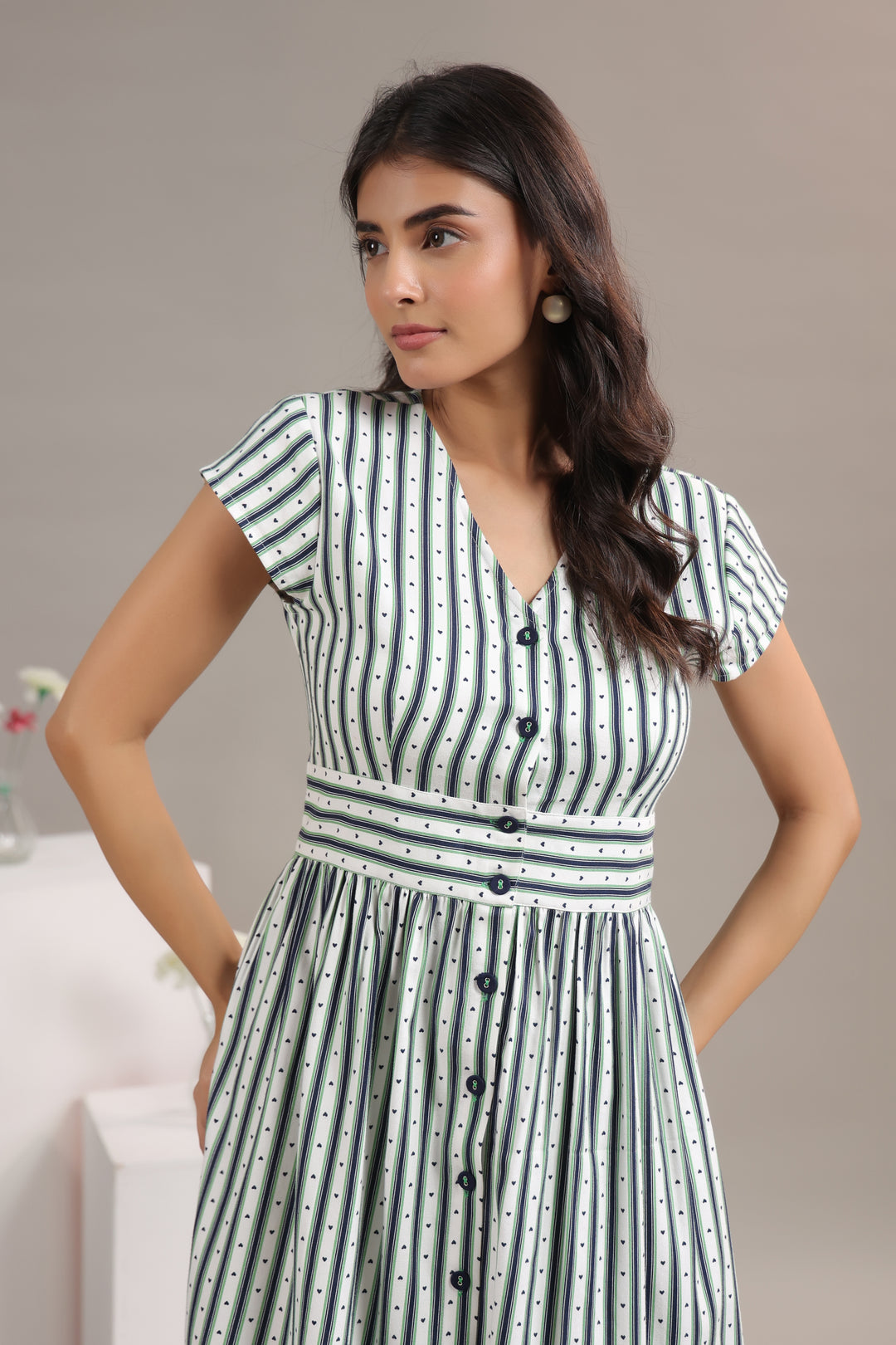 Close up of rayon twill fabric on green striped midi dress for women