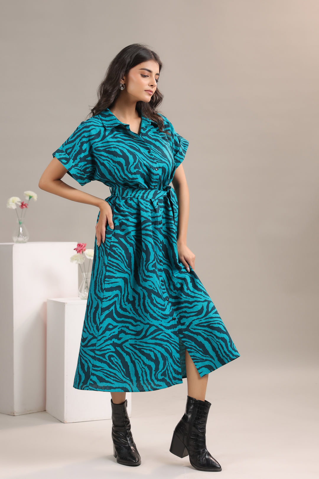 Flowy silhouette of Teal and Black Animal Print Midi Shirt Dress worn by model
