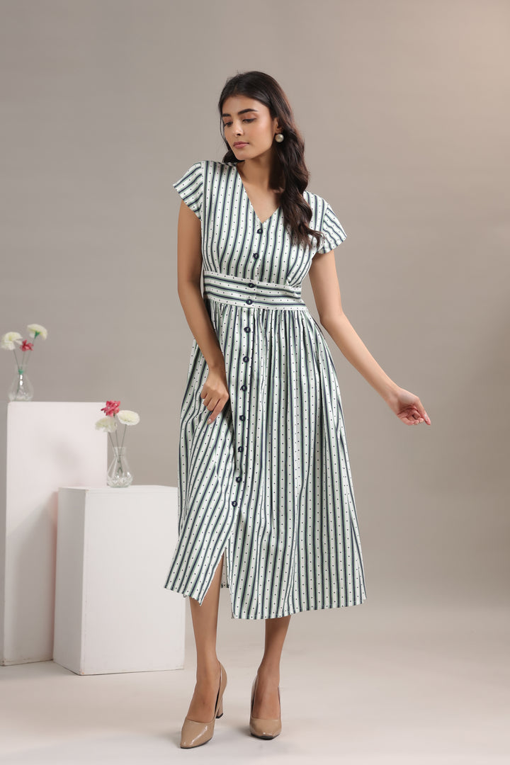 Side view of green striped midi dress for women showing flowy fit