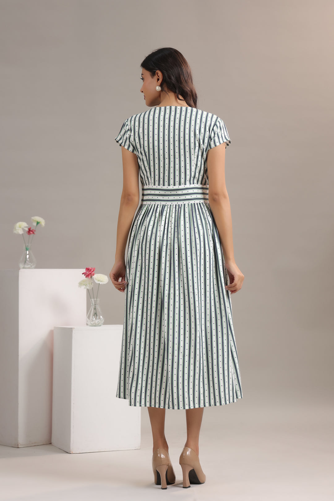 Back view of green striped midi dress for women in rayon twill