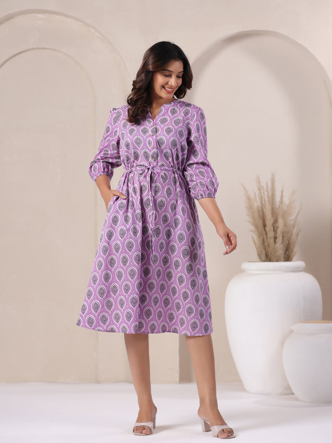 Front style of lavender buti print cotton midi dress showing flowy hemline