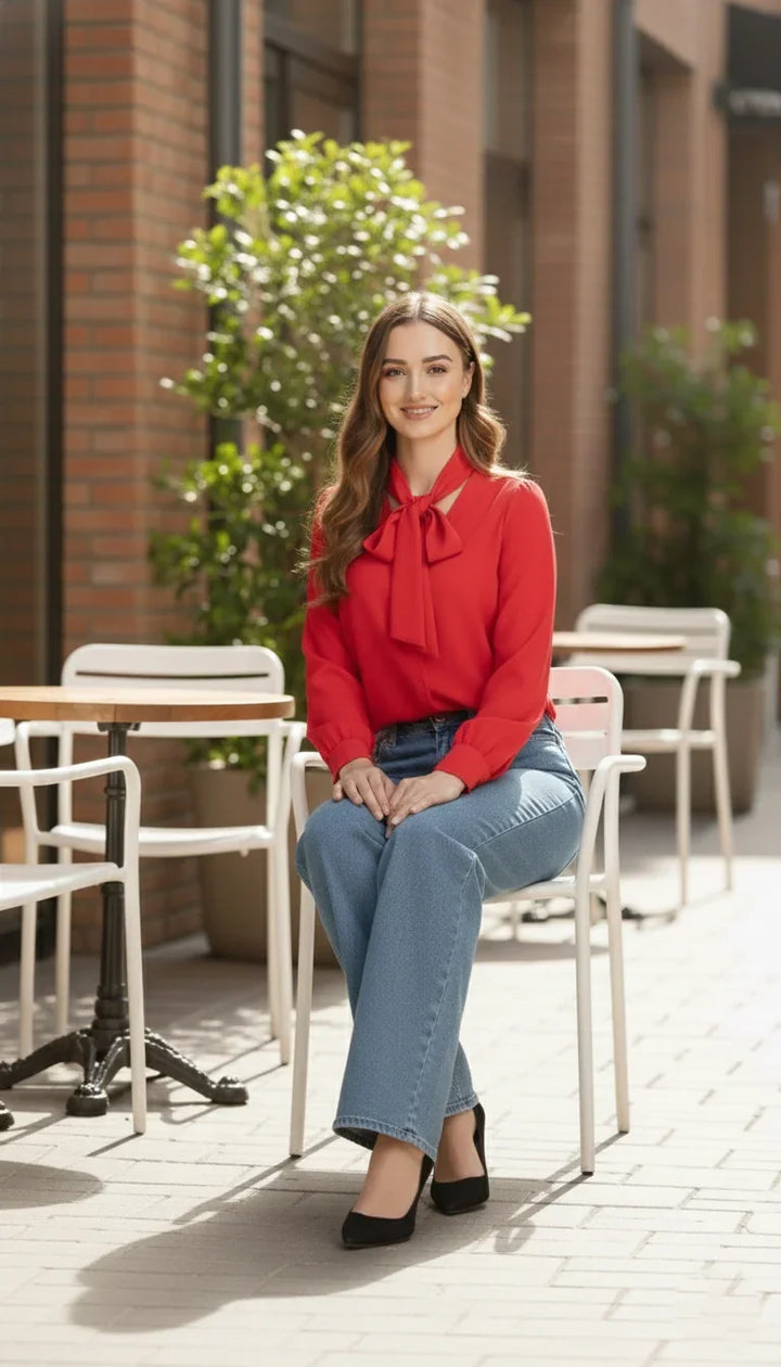 Close-up of tie-up neckline detail on red shirt