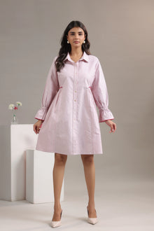 Woman wearing red and white striped dress with collar neck, long sleeves, and flowy fit
