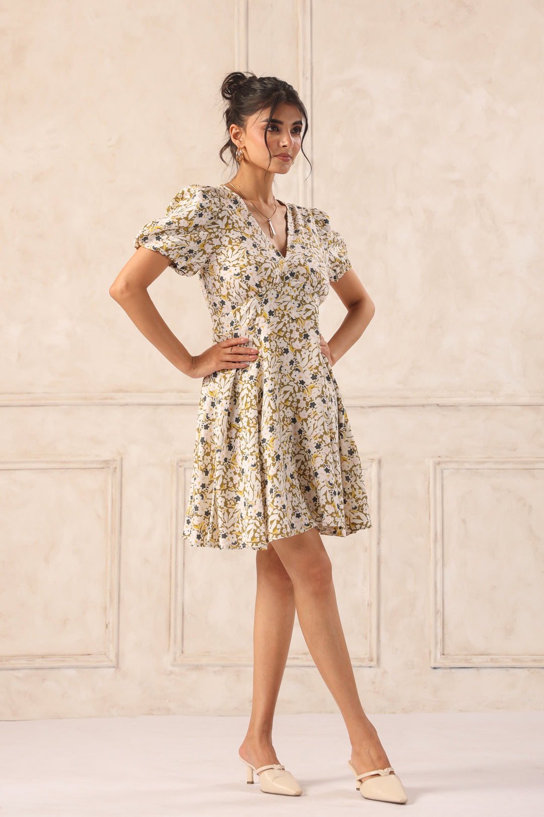 Woman in floral print wrap dress with puff sleeves, styled for Western wear fashion