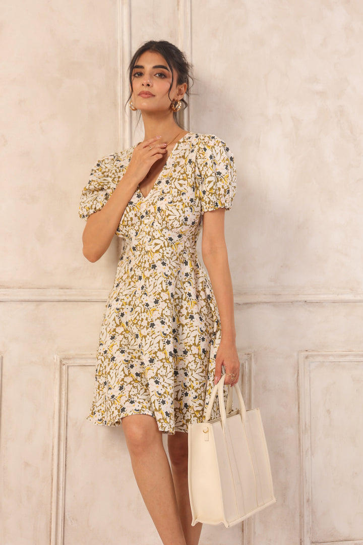 Floral print dress with puff sleeves, V-neck, and flared skirt, paired with cream tote bag