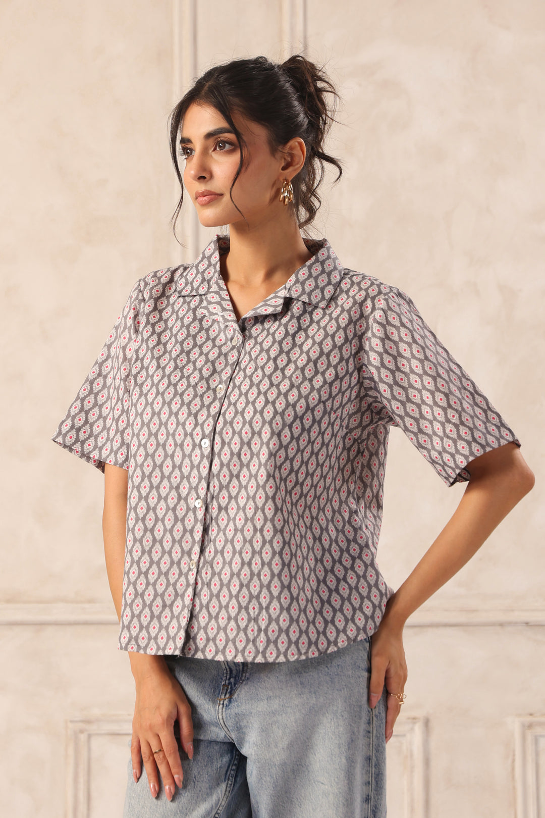 Chic Western wear shirt with geometric print, paired with jeans for a stylish look