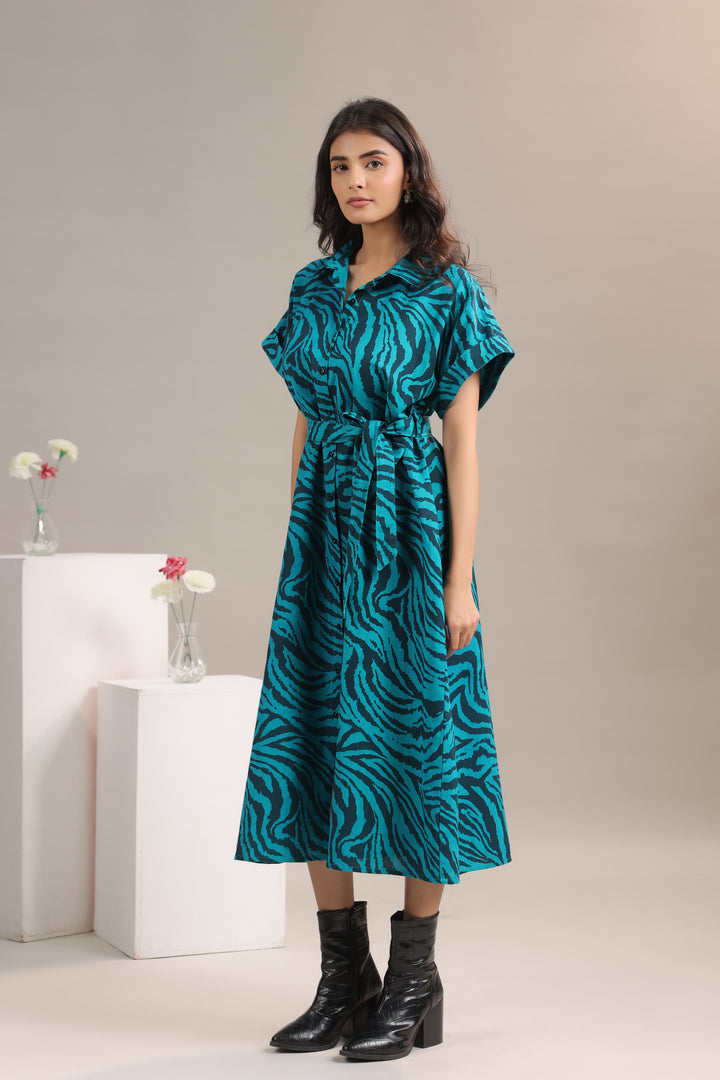 Side view of model wearing Teal and Black Animal Print Midi Shirt Dress with Belt by June 9 Clothing |  leftside