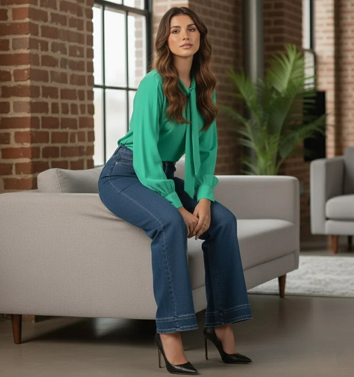 Close-up of tie-up neckline detail on green shirt