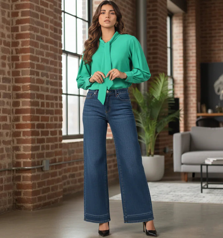 Green shirt styled with wide leg jeans for casual wear