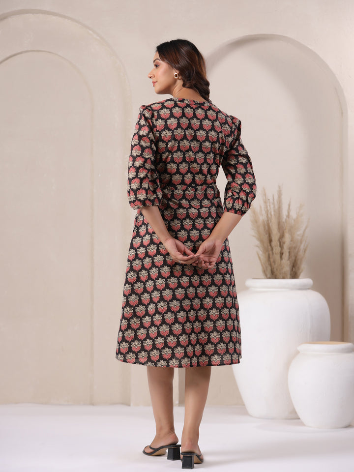 Back view of black Ajrakh buta print midi dress in woven cotton.