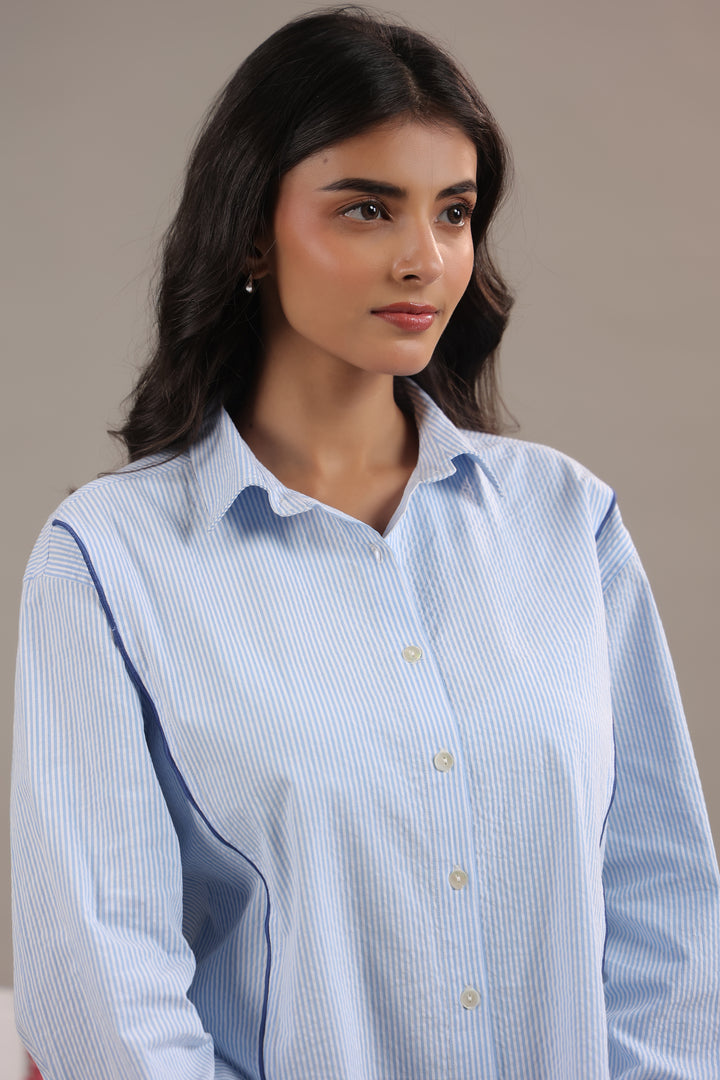 Close-up of blue and white striped shirt women highlighting collar and fabric texture