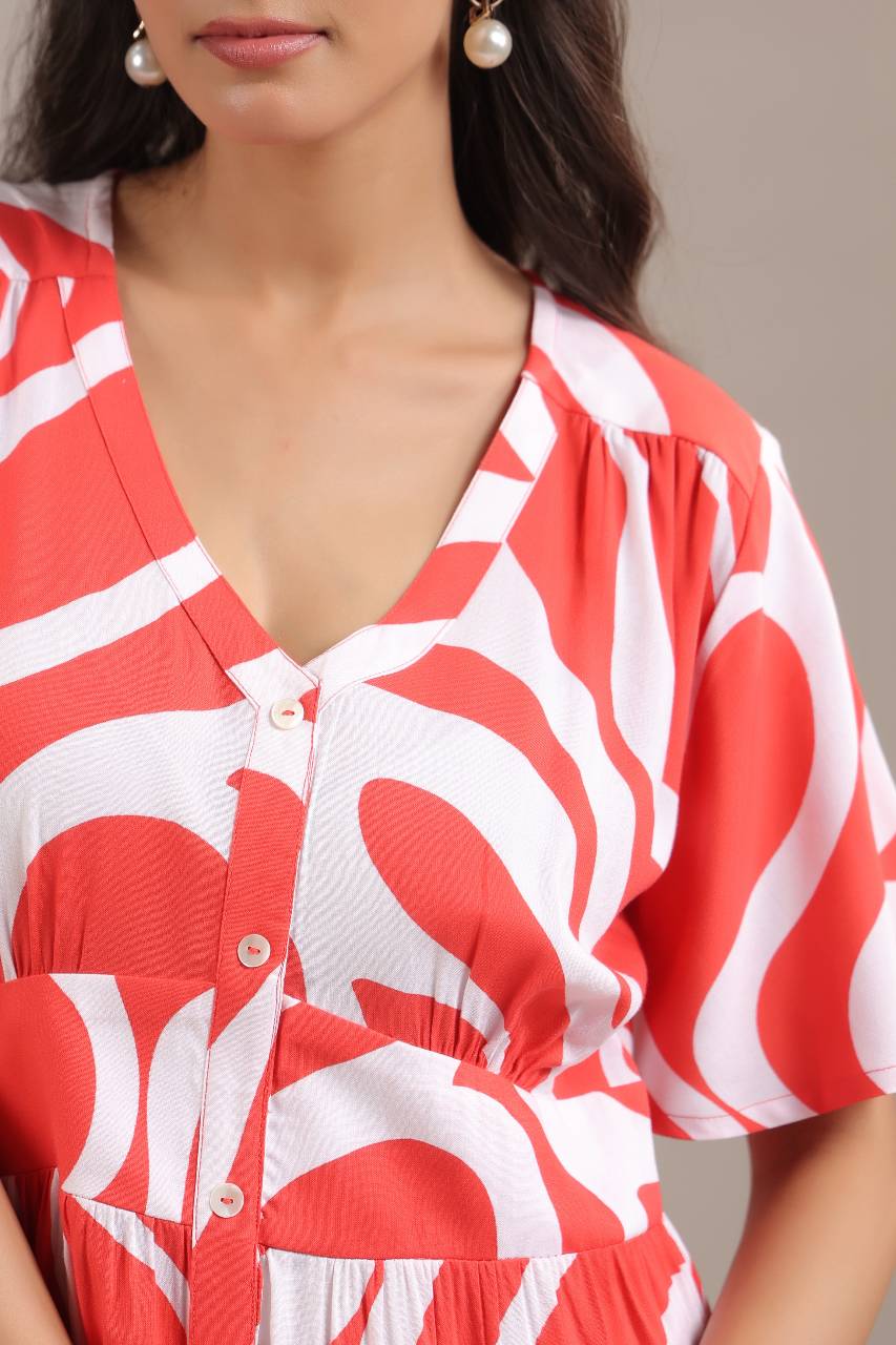 Close-up of red abstract pattern on womens mini dress