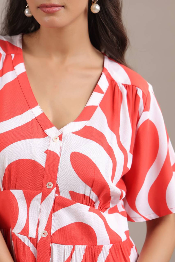 Close-up of red abstract pattern on womens mini dress
