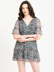 Woman wearing a short floral chiffon dress with V-neck and ruffled sleeves, Western wear style