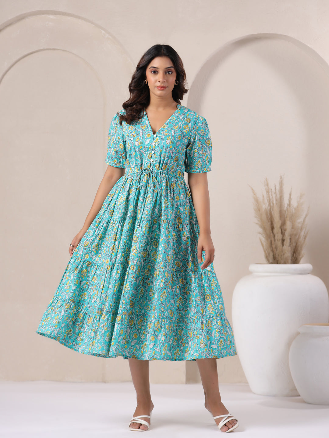 Flared hemline of sky blue floral jaal printed cotton maxi dress.