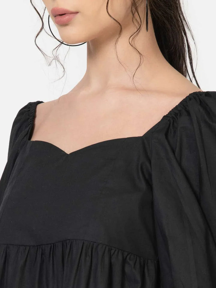 Close-up of cotton poplin fabric texture on black maxi dress - neckline detail of black maxi dress for women