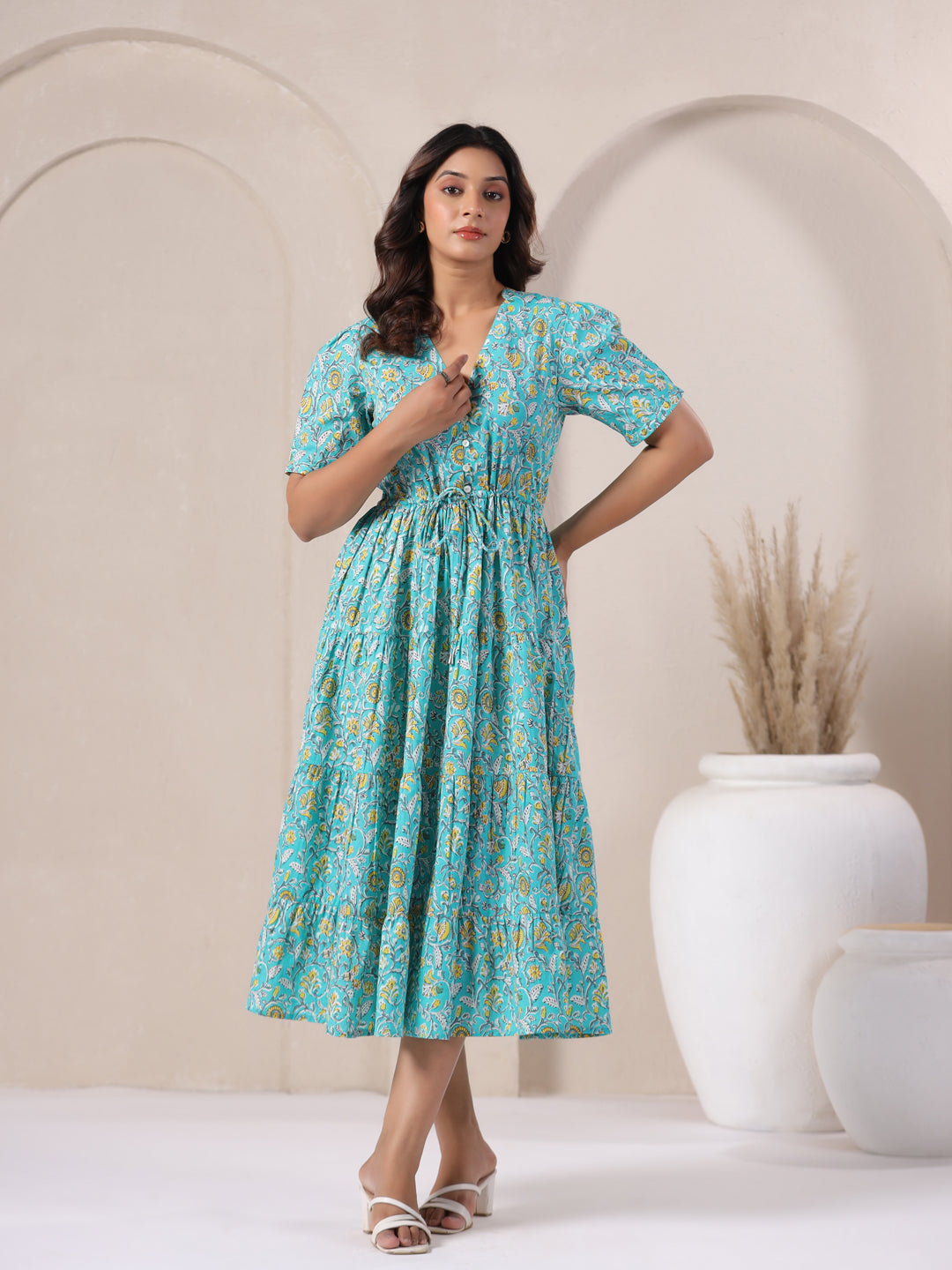 Sky blue cotton maxi dress with floral jaal print and flared hemline.